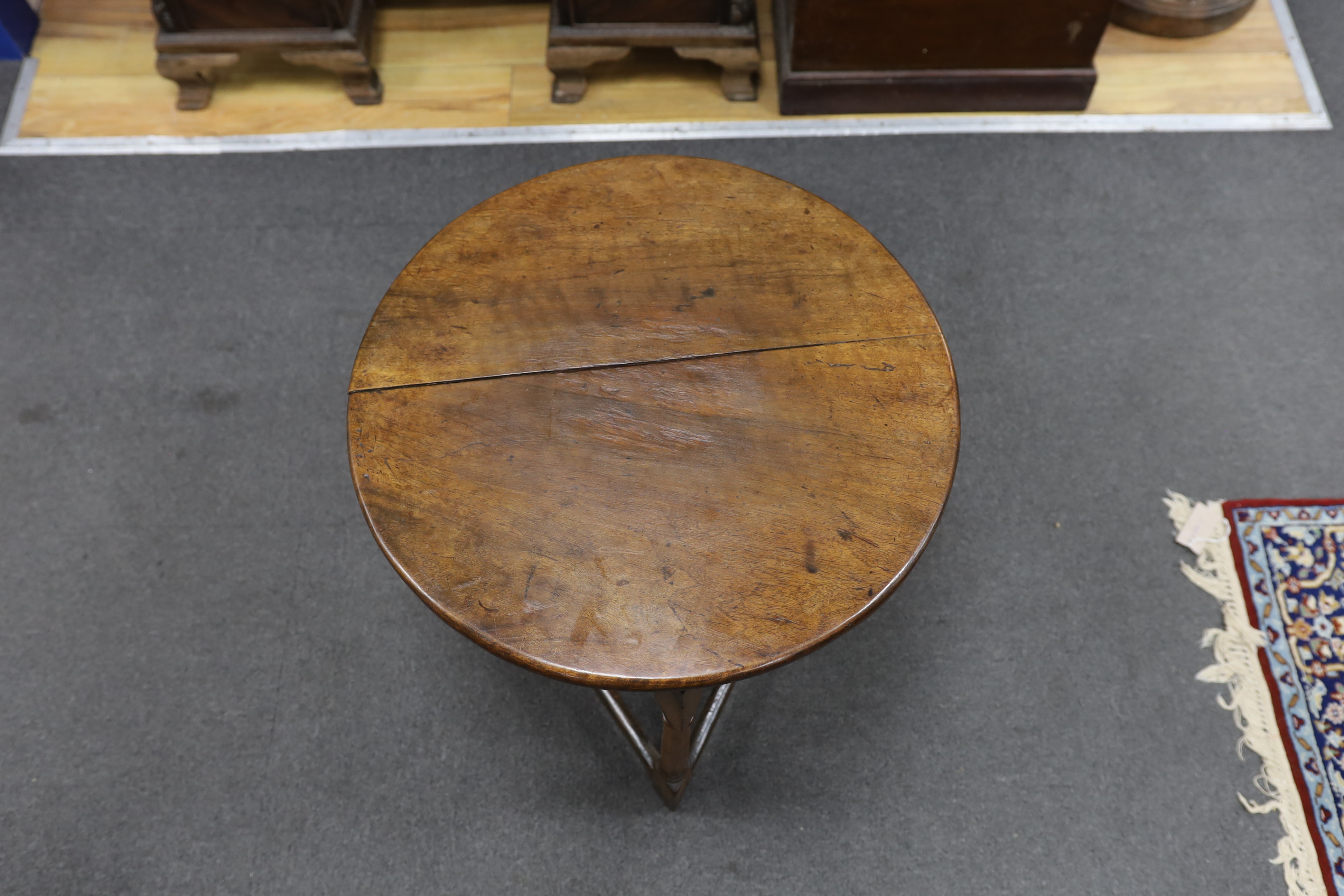 A 19th century fruitwood cricket table, diameter 53cm, height 56cm